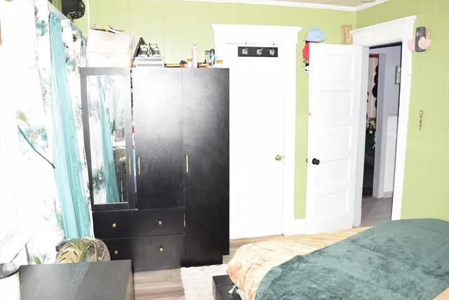 a bedroom with bed and furniture