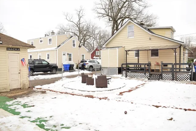 a view of a house with snow on the roof