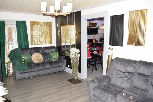 a very nice looking room with a large window and chandelier