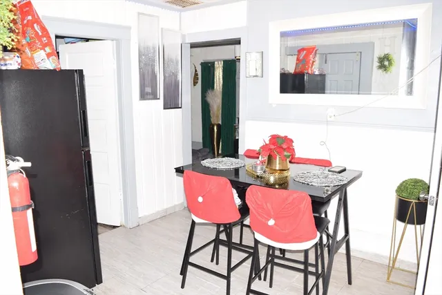 a bathroom with a sink toilet and a mirror