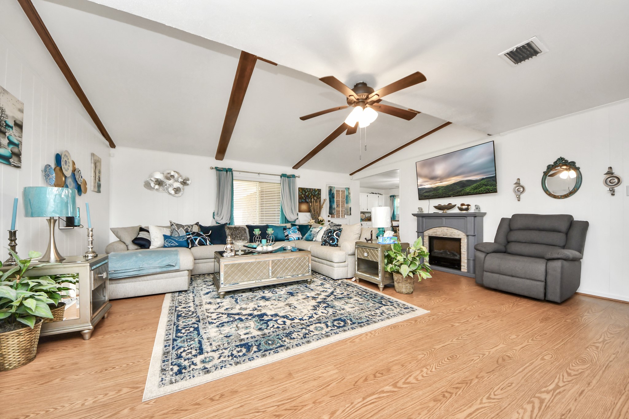 1805 9th Street Hempstead, TX 77445 - Photo 16 of 35 a living room with furniture and a fireplace