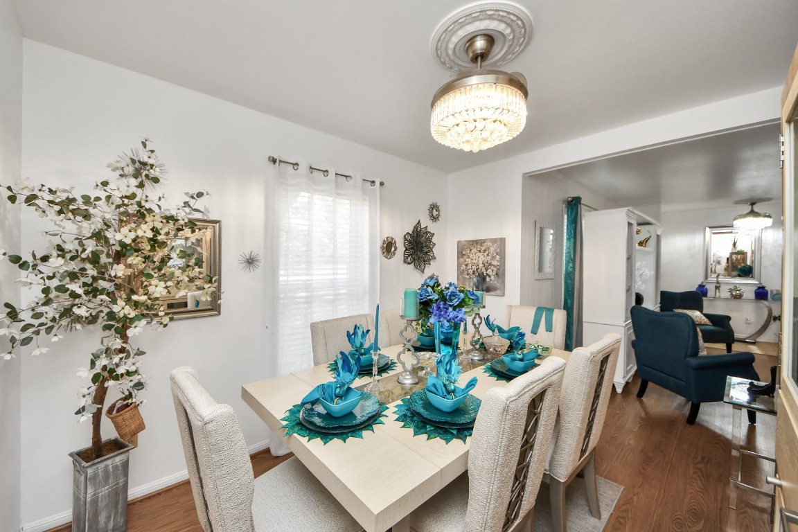 1805 9th Street Hempstead, TX 77445 - Photo 17 of 35 a view of a dining room with furniture and chandelier