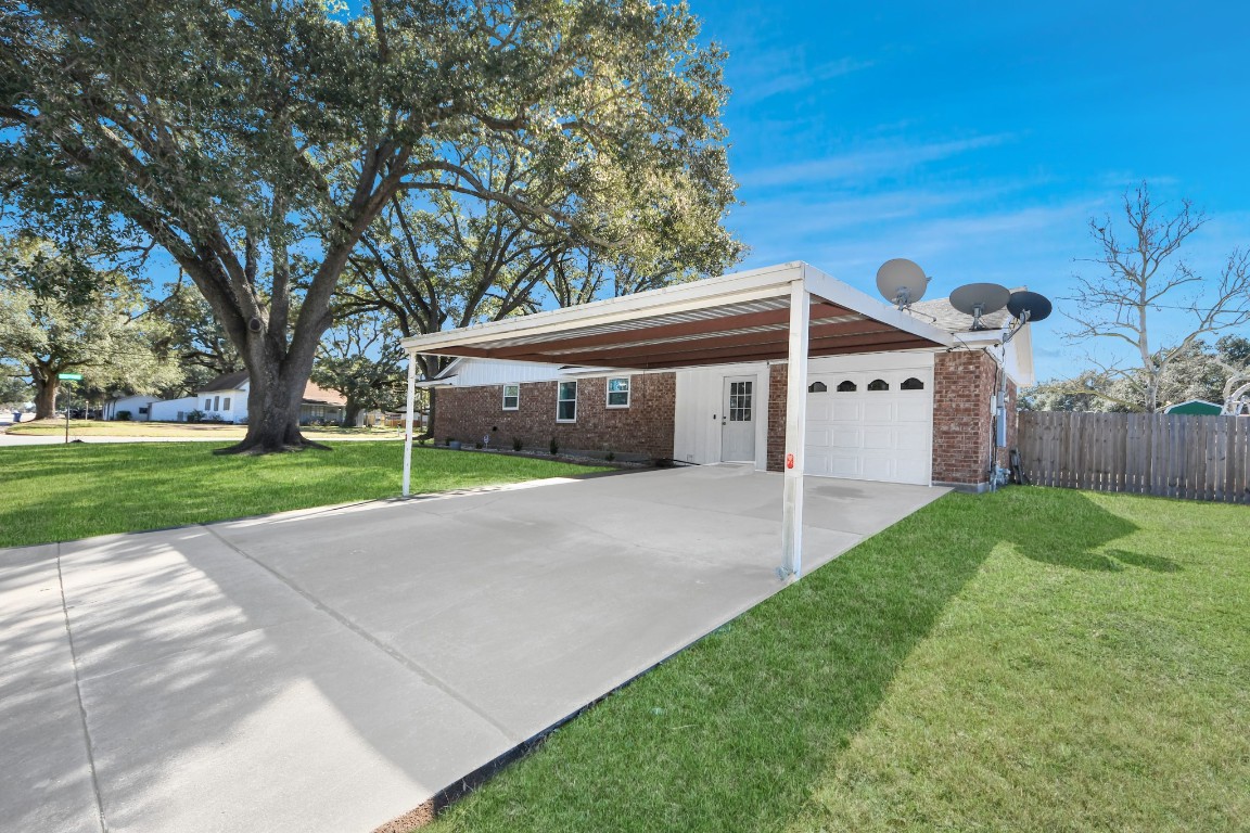 1805 9th Street Hempstead, TX 77445 - Photo 2 of 35 a view of a house with a yard