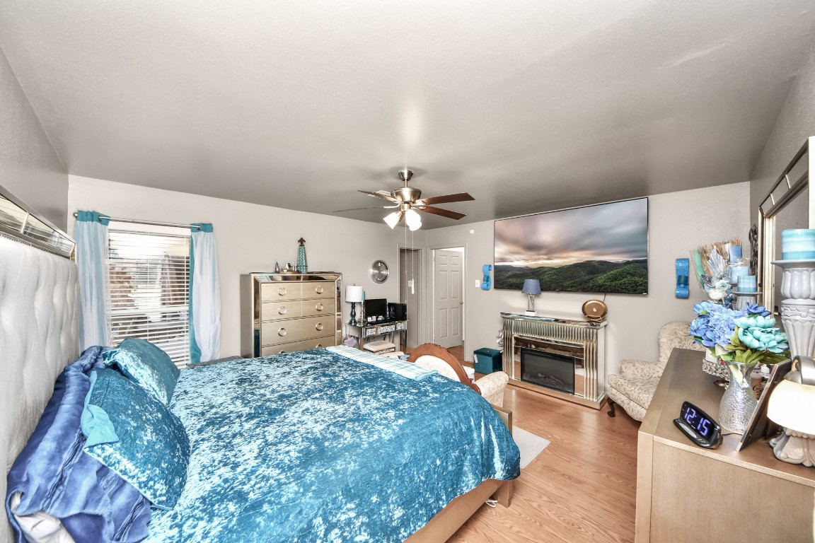 1805 9th Street Hempstead, TX 77445 - Photo 21 of 35 a living room with furniture a fireplace and a chandelier