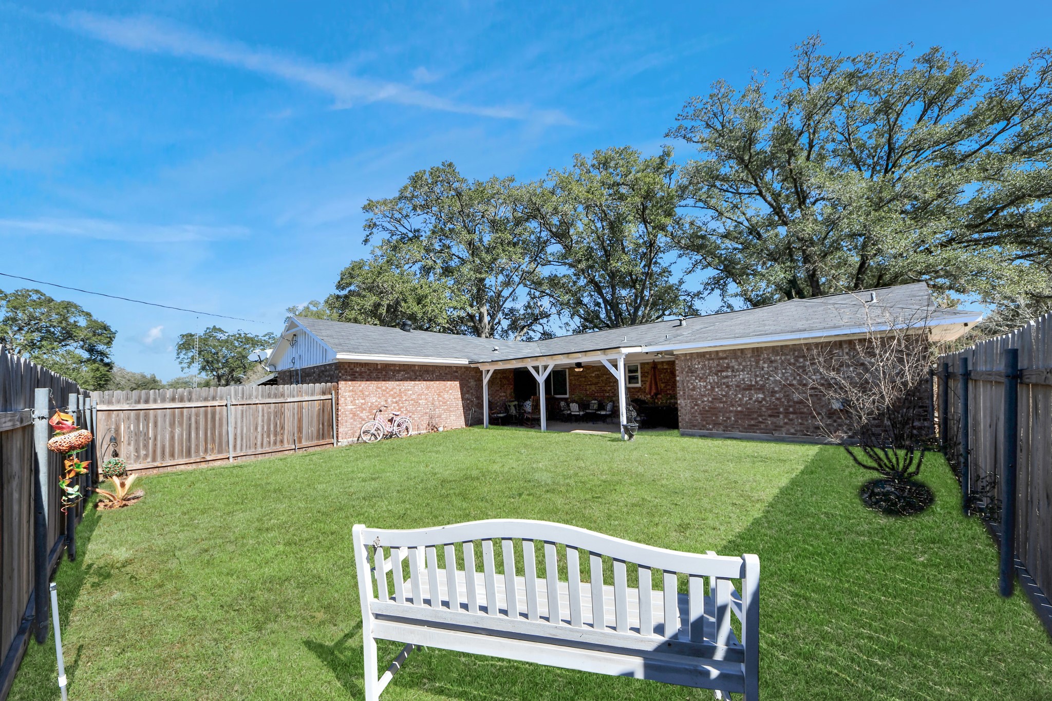 1805 9th Street Hempstead, TX 77445 - Photo 25 of 35 a view of a house with a yard and furniture