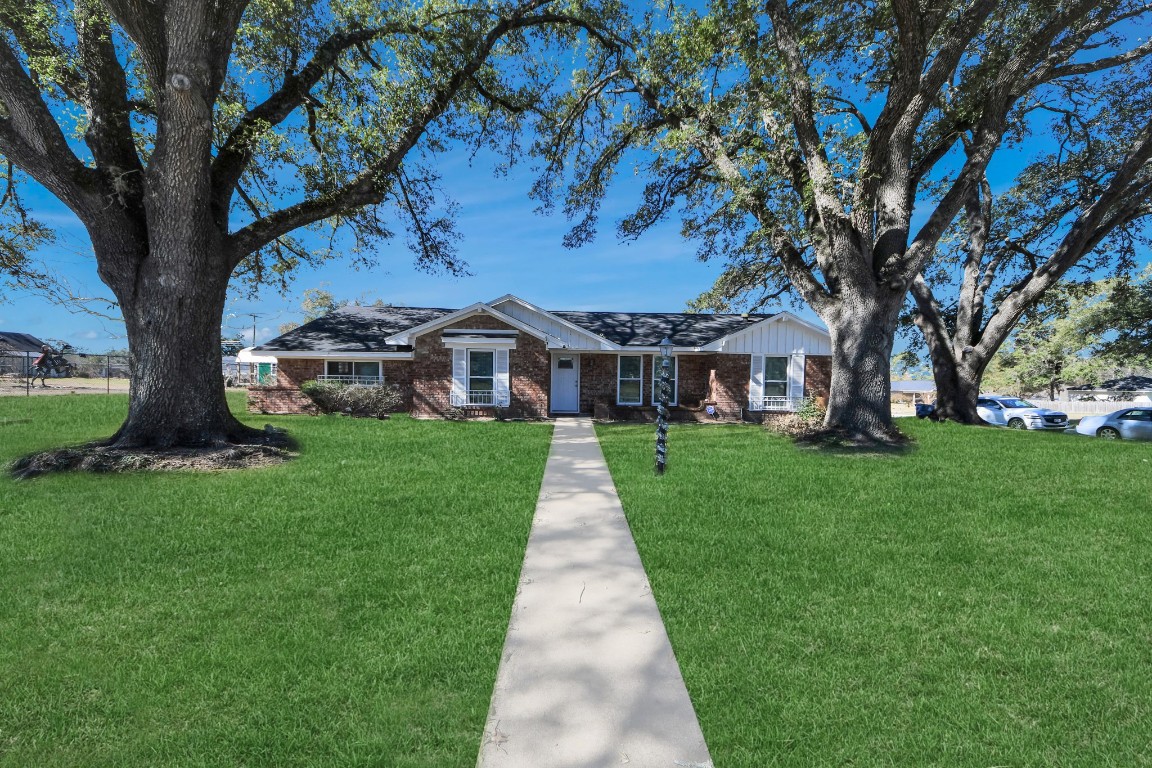 1805 9th Street Hempstead, TX 77445 - Photo 34 of 35 a front view of a house with a yard