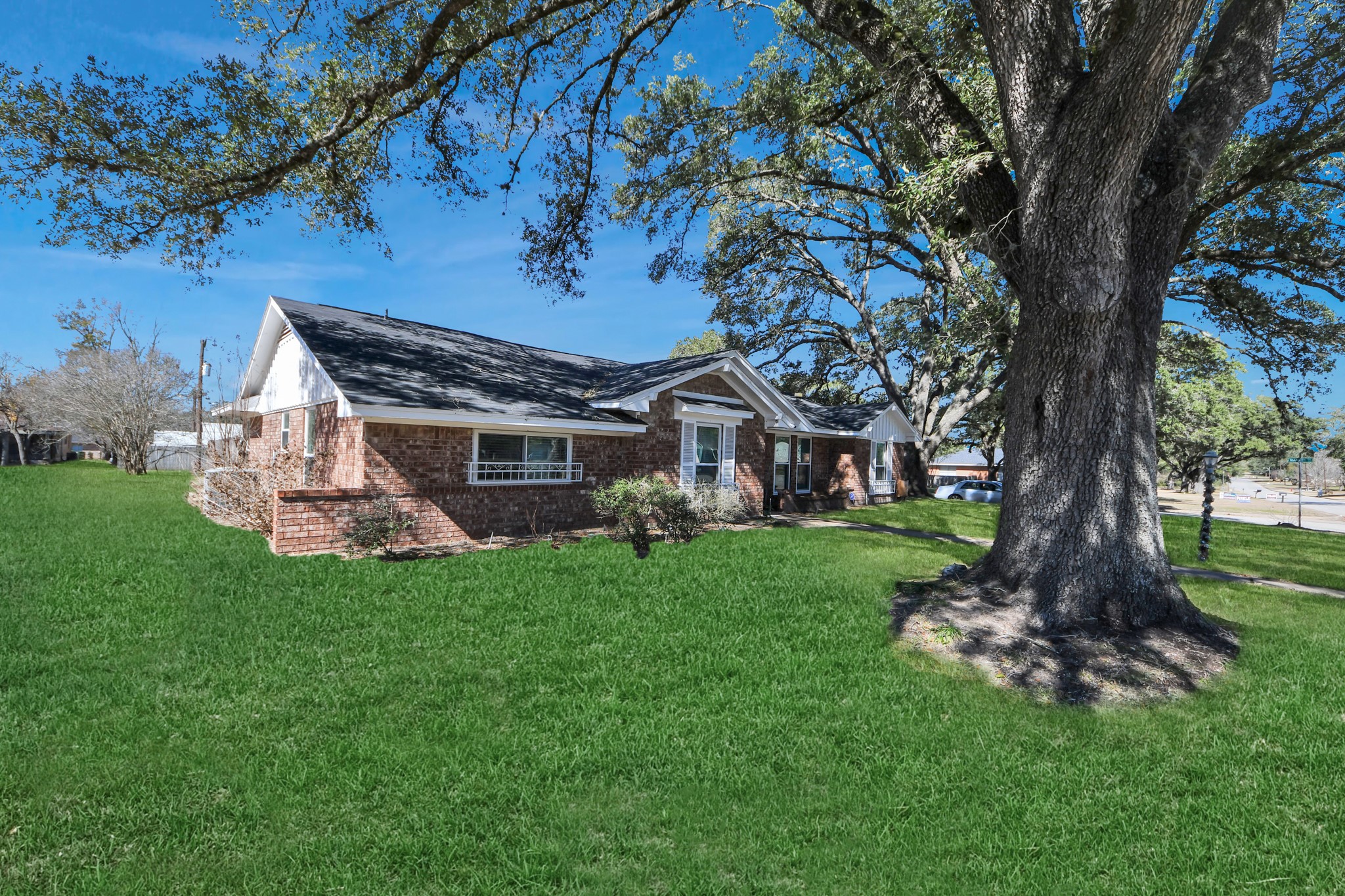 1805 9th Street Hempstead, TX 77445 - Photo 35 of 35 a front view of a house with a garden