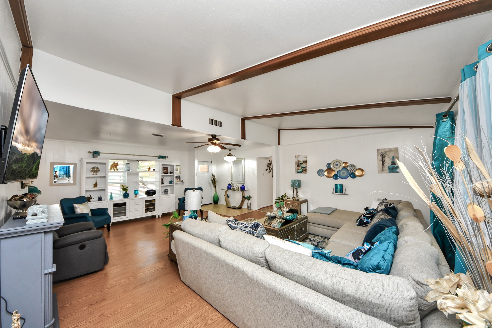 1805 9th Street Hempstead, TX 77445 - Photo 6 of 35 a living room with furniture and a flat screen tv