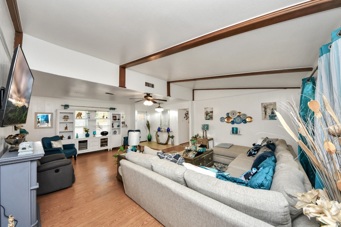 1805 9th Street Hempstead, TX 77445 - Photo 6 of 35 a living room with furniture and a flat screen tv