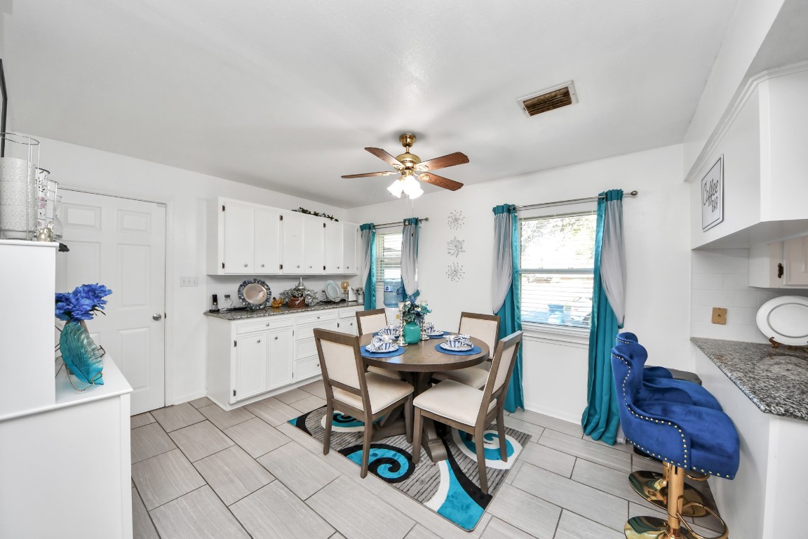 1805 9th Street Hempstead, TX 77445 - Photo 8 of 35 a view of a dining room with furniture and a chandelier
