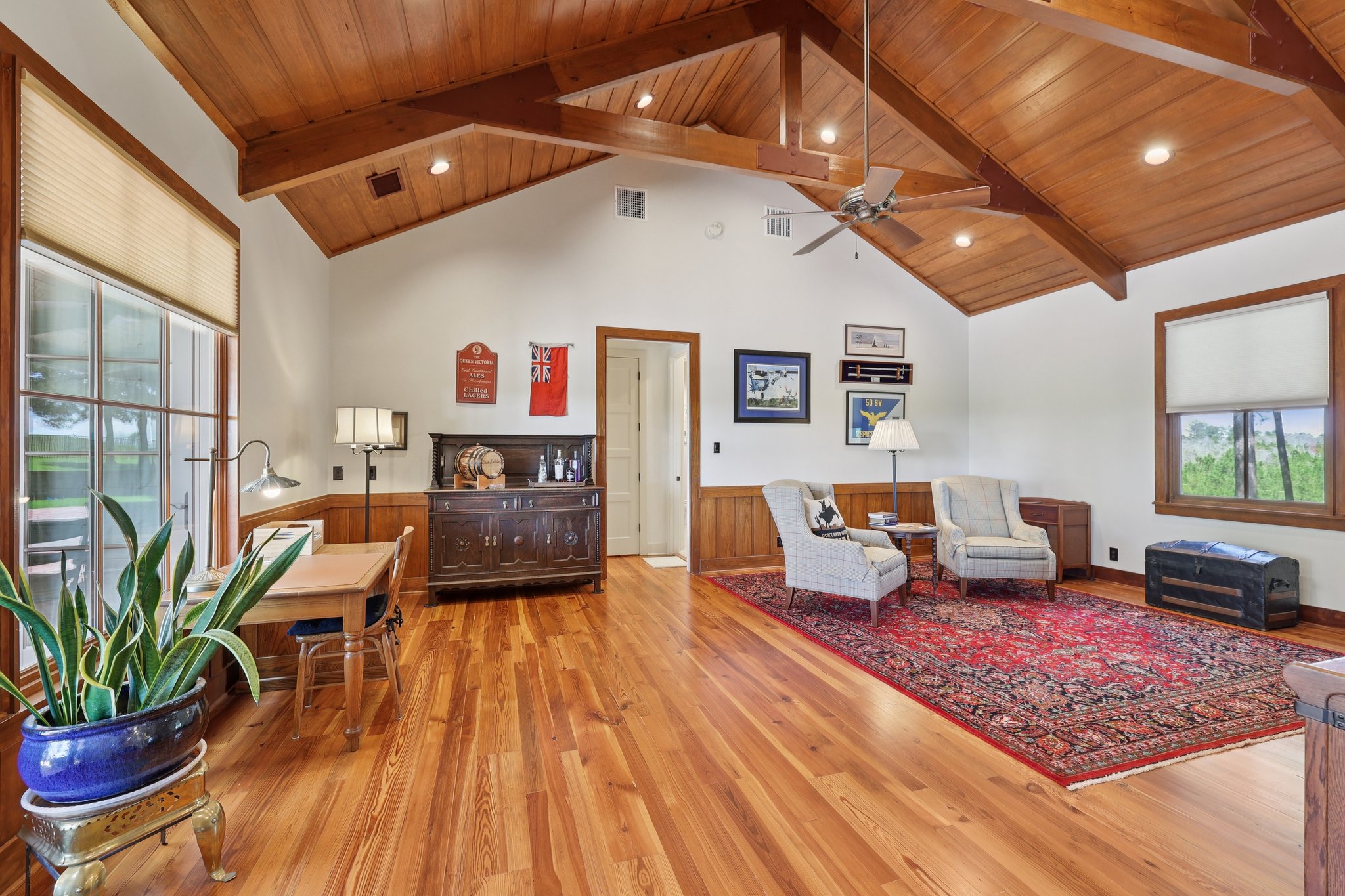 546 McAllister Road Bastrop, TX 78602 - Photo 19 of 40 Sitting room with a high wooden beamed ceiling, light wood finished floors, a wainscoted wall, a ceiling fan, and recessed lighting