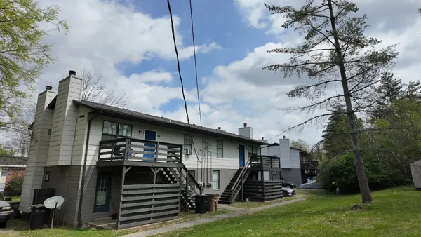 a view of a car park in front of house