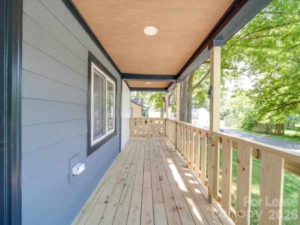 a view of balcony with wooden floor