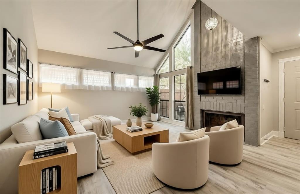 a living room with furniture fireplace and a flat screen tv