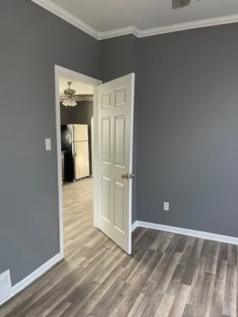 a view of a livingroom with wooden floor and closet