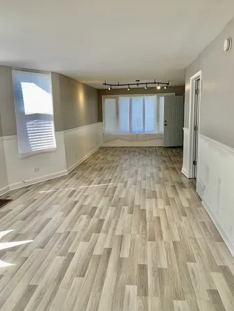 a view of a room with a wooden floor