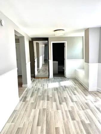 a view of a living room with a bed