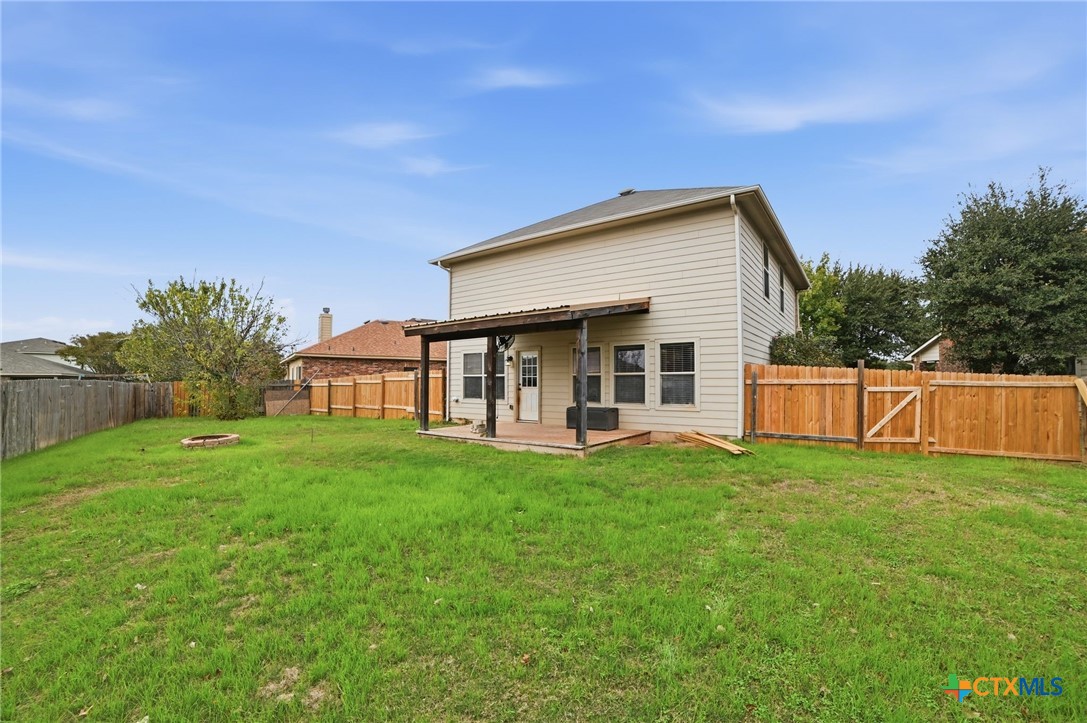 316 Housefinch Loop Leander, TX 78641 - Photo 33 of 37 Expansive fenced backyard with plenty of room to gather, garden or fill with pets.