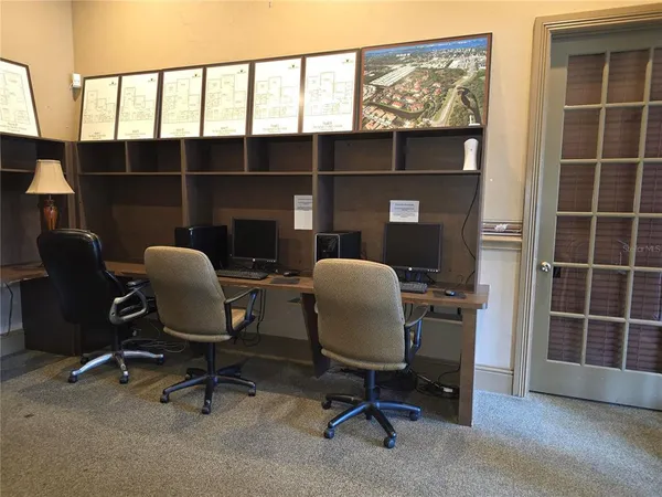 a room with gym equipment and windows