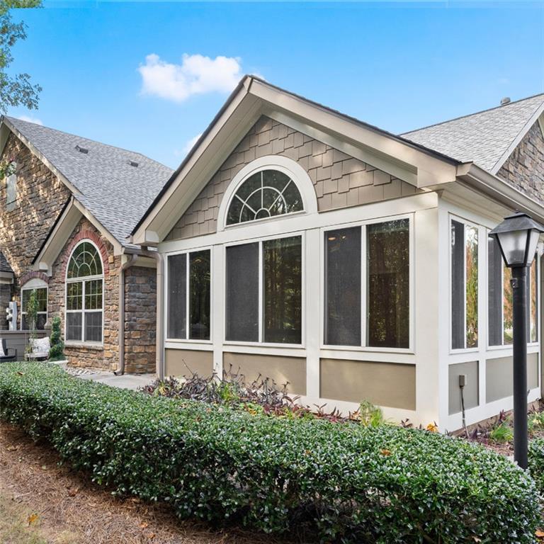 front view of a house with a large window