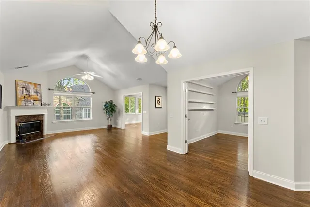 a view of livingroom with fireplace wooden floor and window