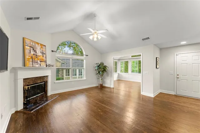 a kitchen with kitchen island granite countertop a sink and cabinets
