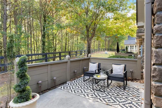 a bathroom with a granite countertop sink a mirror and a shower