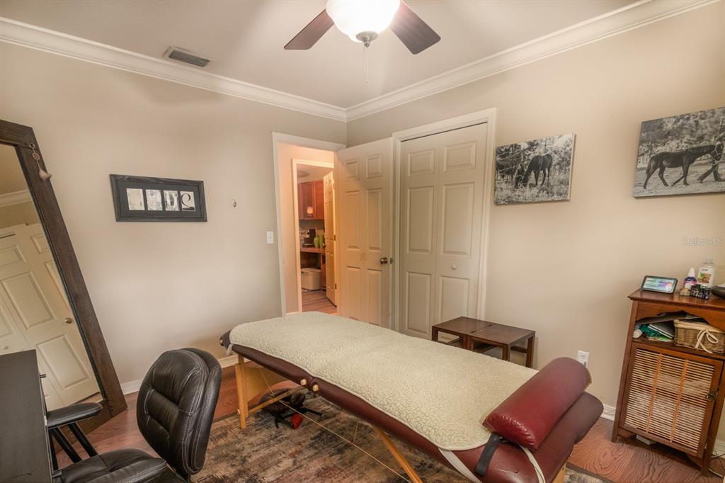 560 North Lake Pleasant Road Apopka, FL 32712 - Photo 17 of 85 a room with furniture and a chair