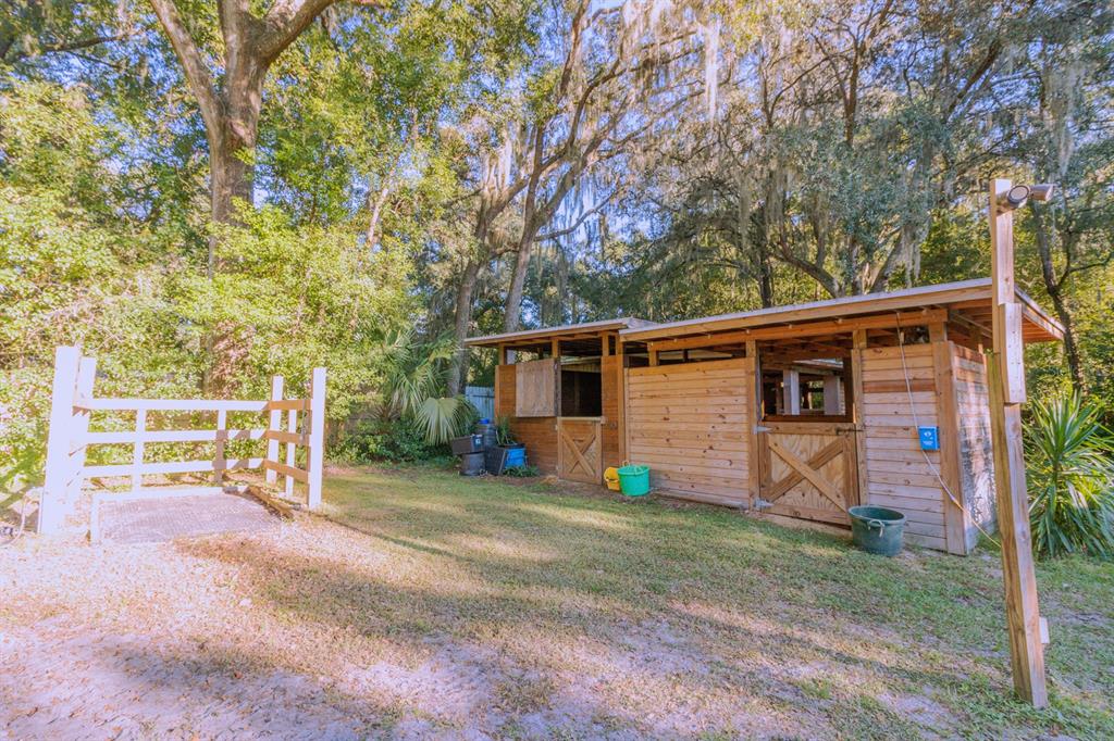 560 North Lake Pleasant Road Apopka, FL 32712 - Photo 58 of 85 a view of a house with a yard and large tree