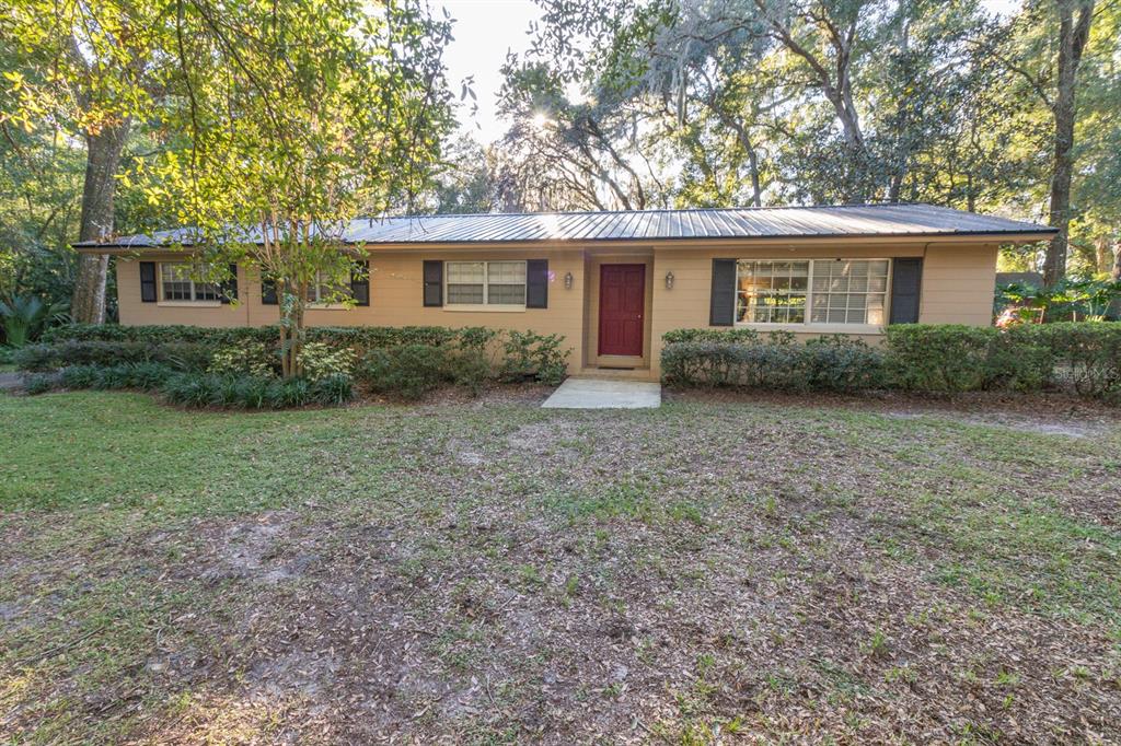 560 North Lake Pleasant Road Apopka, FL 32712 - Photo 60 of 85 a view of a house with yard and a garden