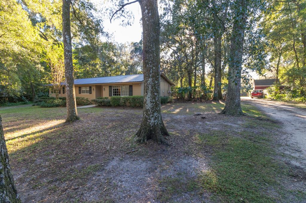 560 North Lake Pleasant Road Apopka, FL 32712 - Photo 61 of 85 a view of a house with backyard and trees