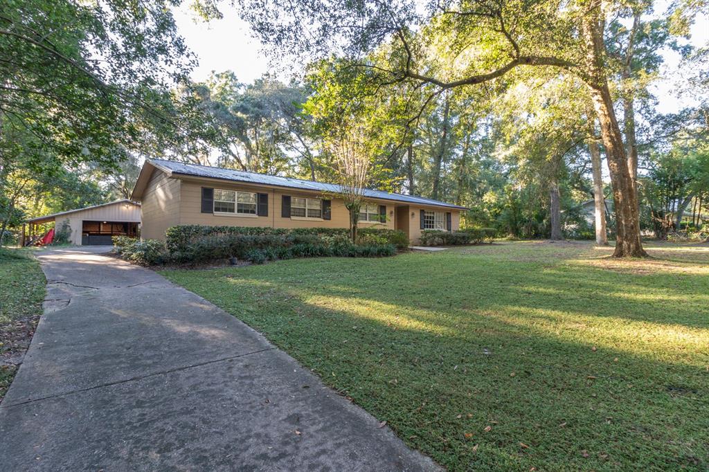 560 North Lake Pleasant Road Apopka, FL 32712 - Photo 62 of 85 a house view with a garden space