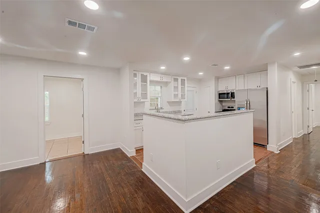 a view of kitchen with wooden floor