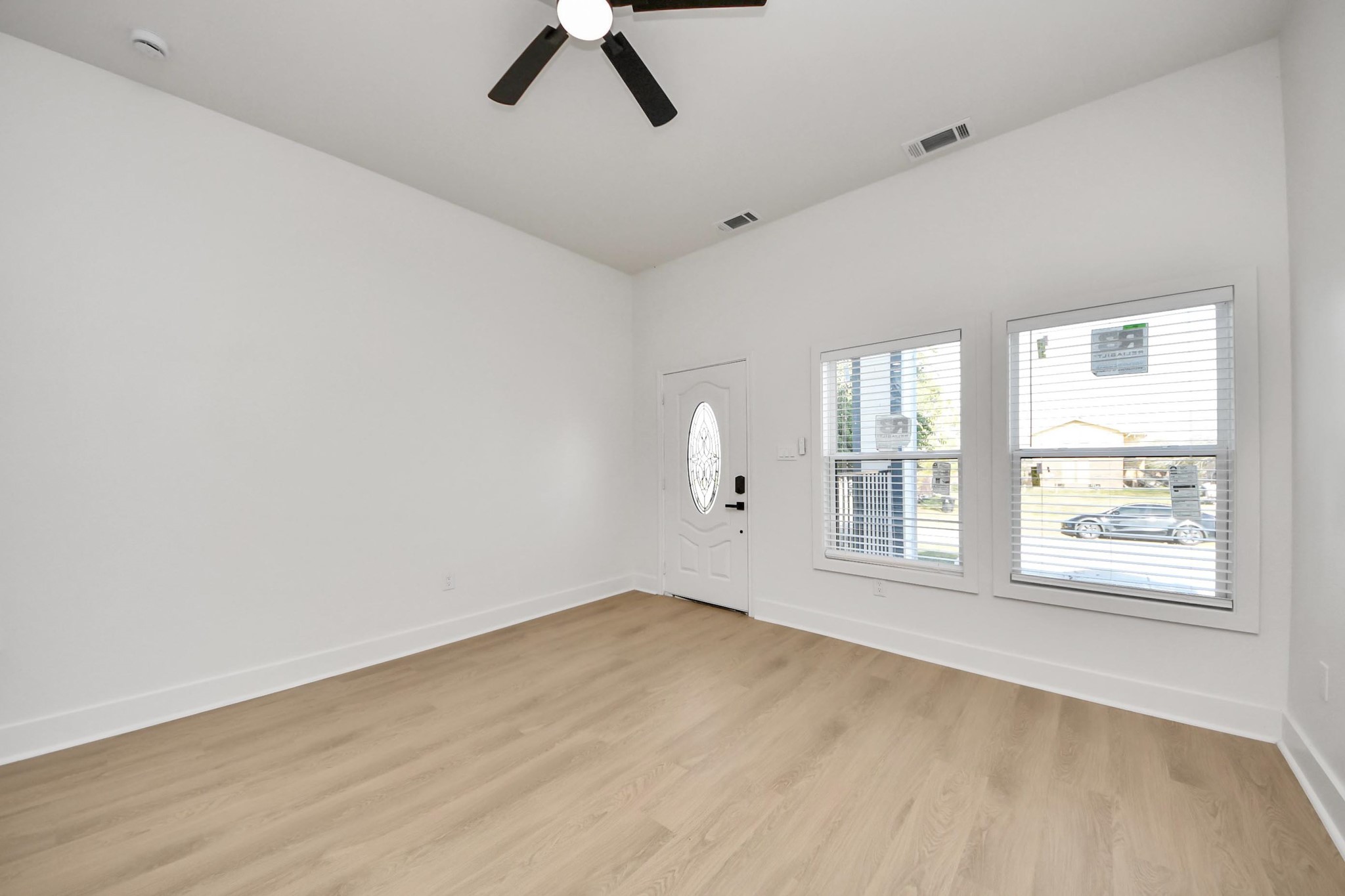 5226 Ricky Street Houston, TX 77033 - Photo 11 of 50 an empty room with windows and cabinet