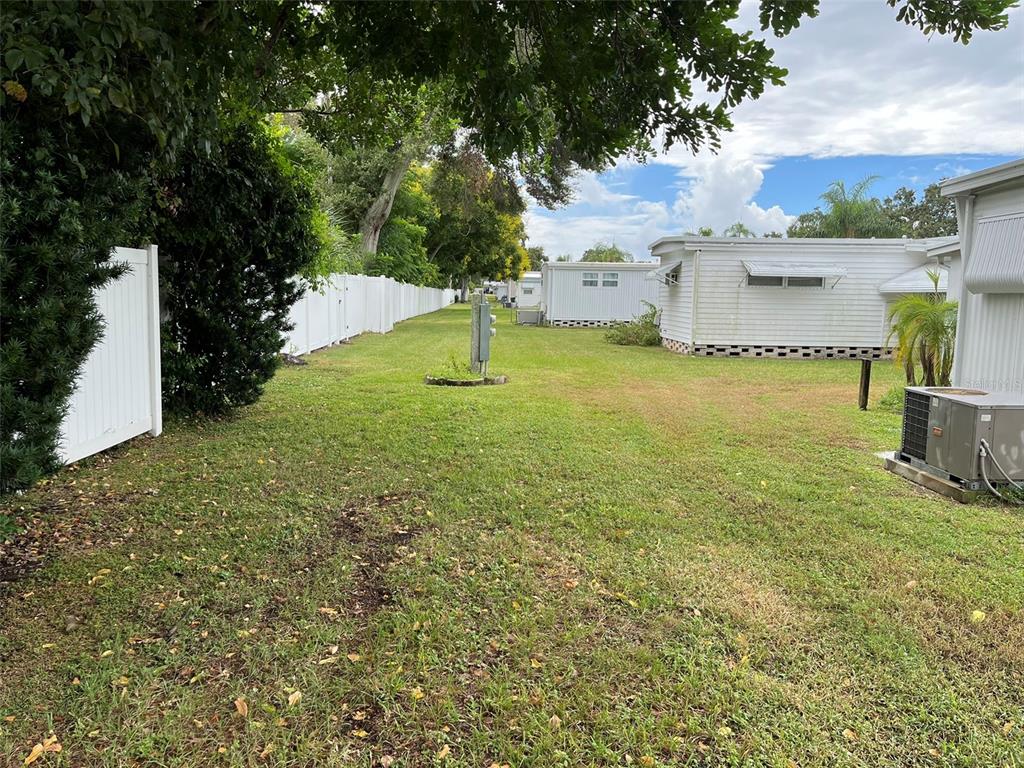 1040 Main Street, Unit 193 Dunedin, FL 34698 - Photo 6 of 16 a view of a yard with an outdoor space