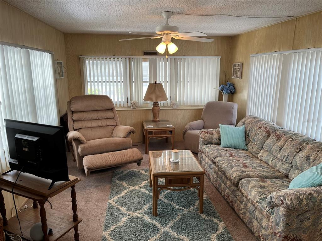 1040 Main Street, Unit 193 Dunedin, FL 34698 - Photo 7 of 16 a living room with furniture and a window