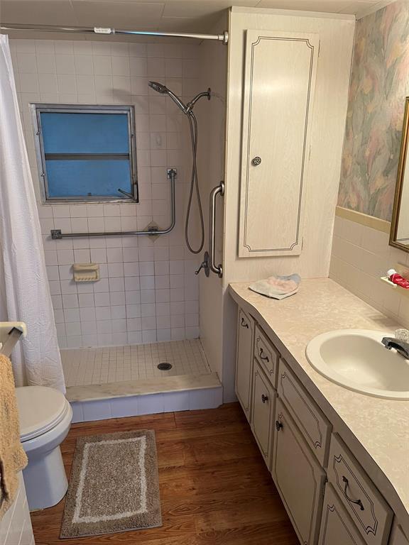 1040 Main Street, Unit 193 Dunedin, FL 34698 - Photo 9 of 16 a bathroom with a granite countertop sink toilet and shower