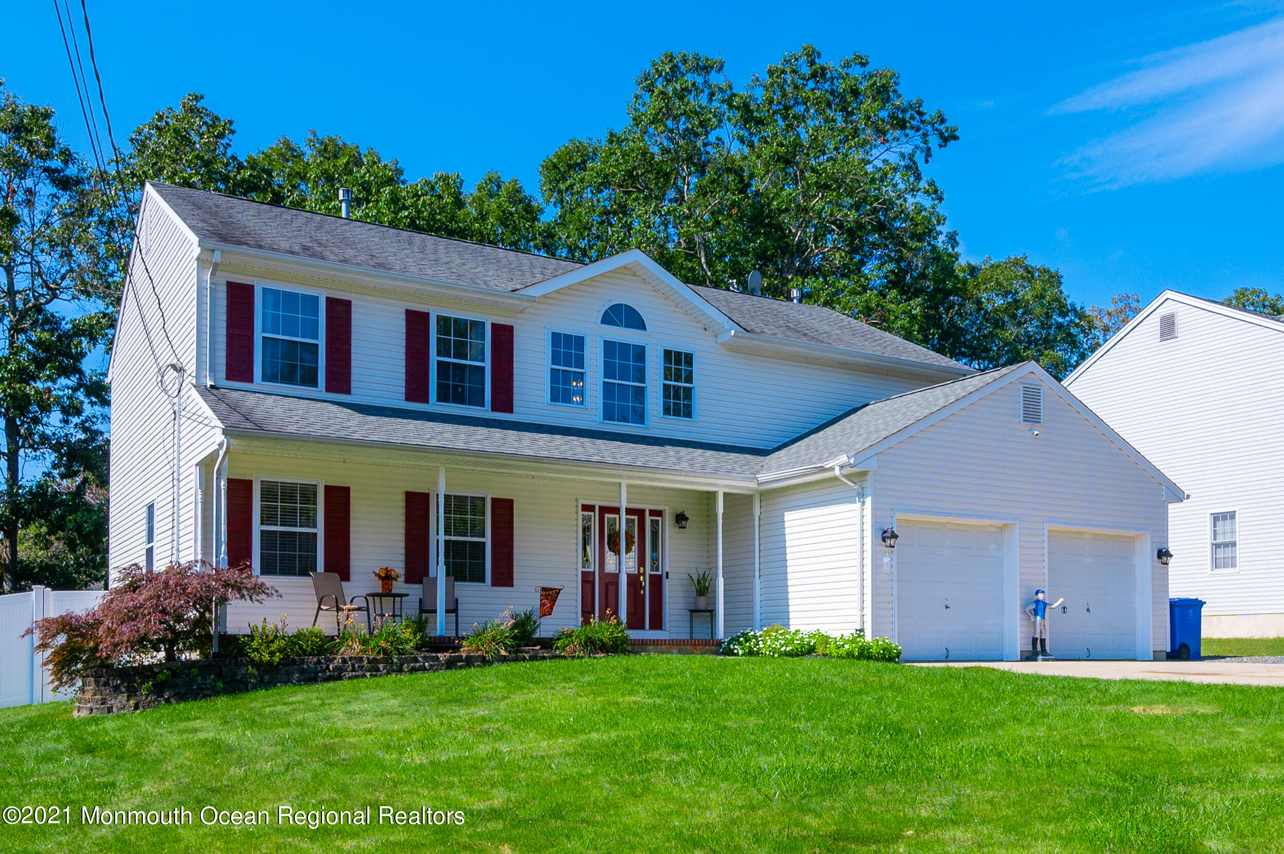 121 Lanyard Road Manahawkin, NJ 08050 - Photo 1 of 39 front view of a house with a yard
