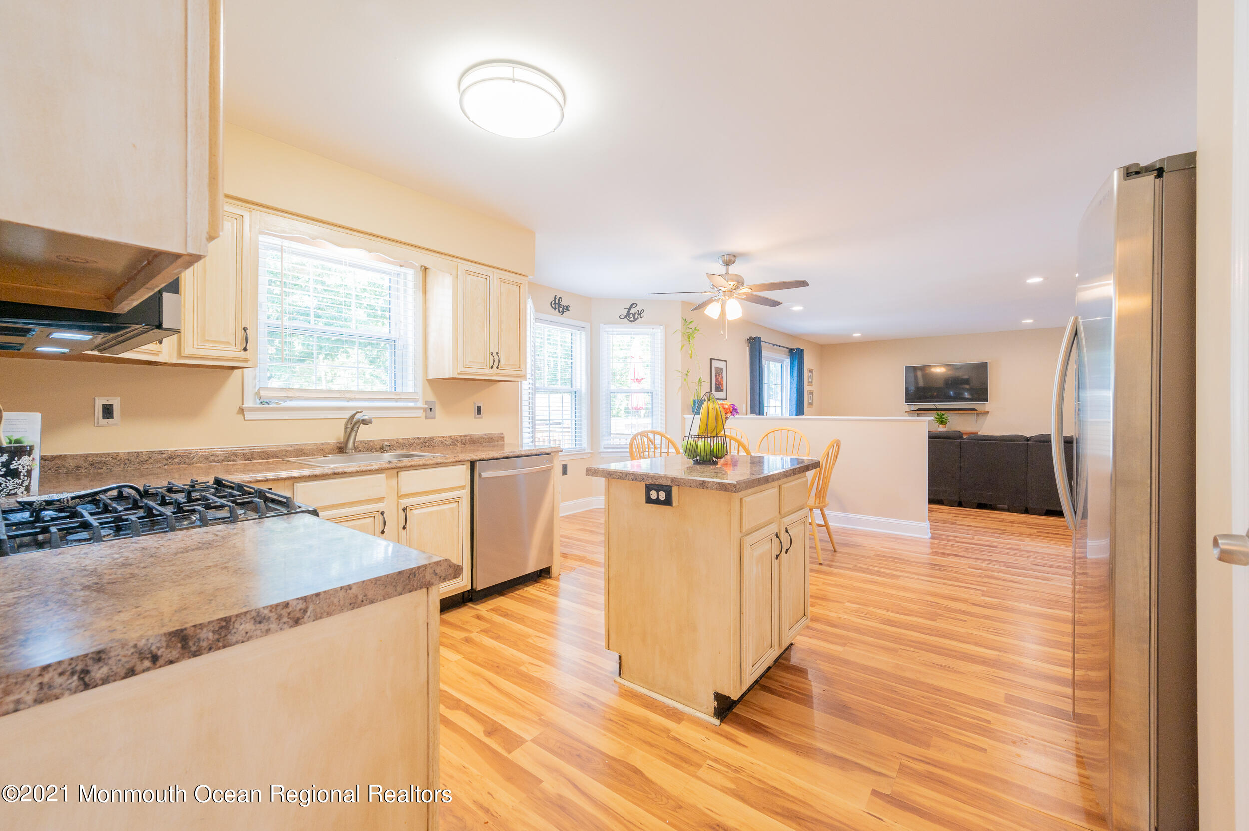 121 Lanyard Road Manahawkin, NJ 08050 - Photo 12 of 39 a kitchen with stainless steel appliances granite countertop a sink stove and refrigerator
