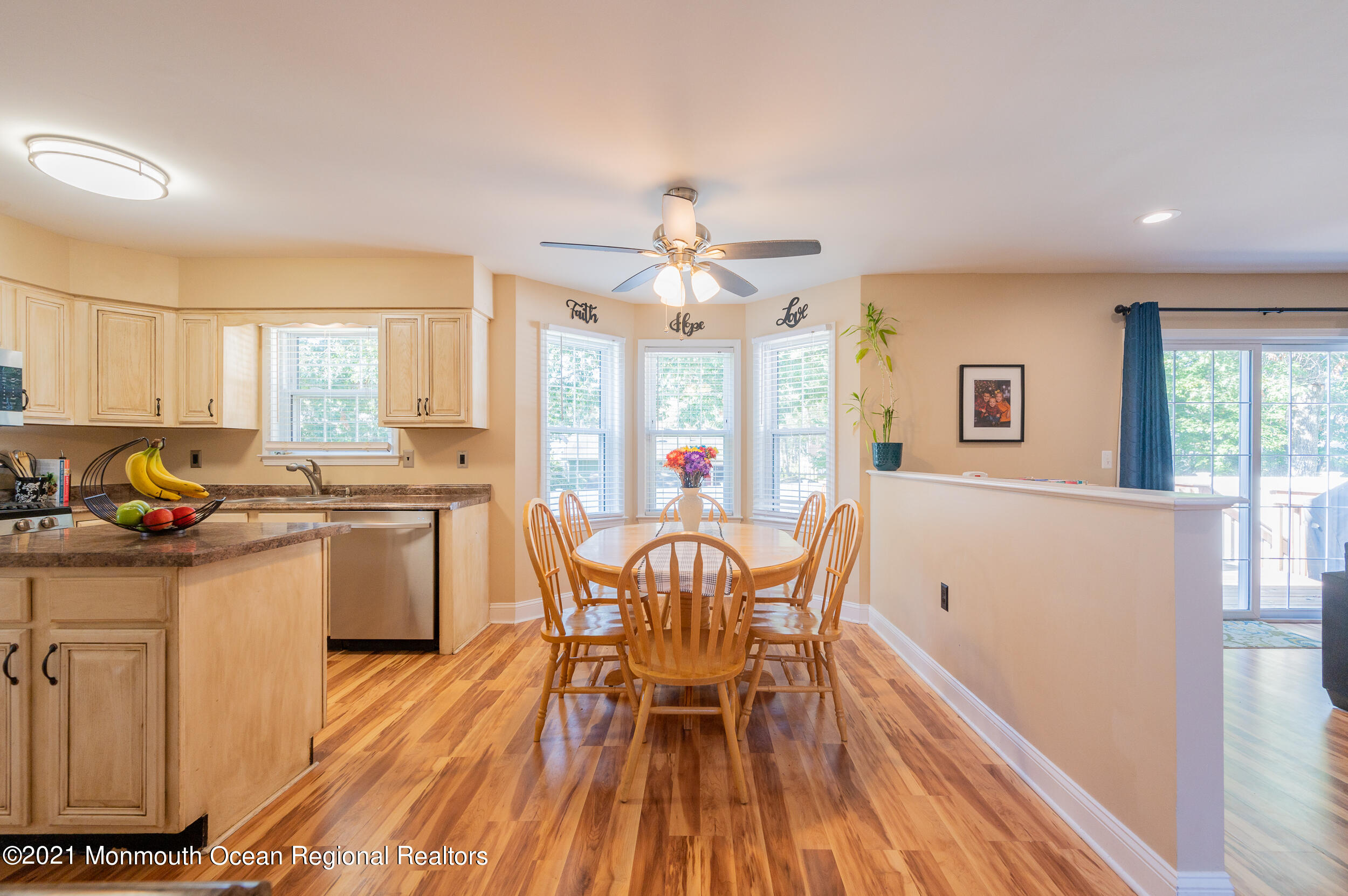 121 Lanyard Road Manahawkin, NJ 08050 - Photo 15 of 39 a view of a dining room with furniture window and wooden floor