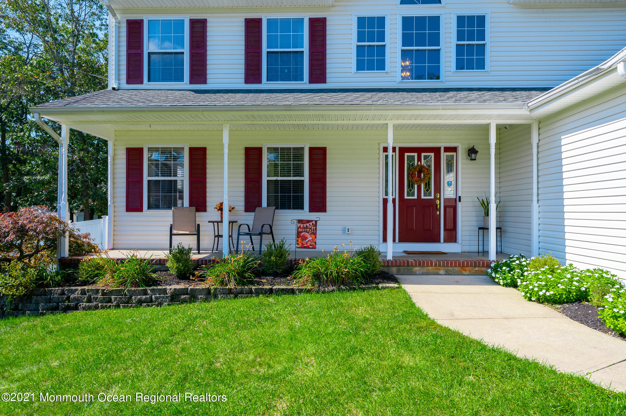 121 Lanyard Road Manahawkin, NJ 08050 - Photo 3 of 39 a view of a house with potted plants and a yard