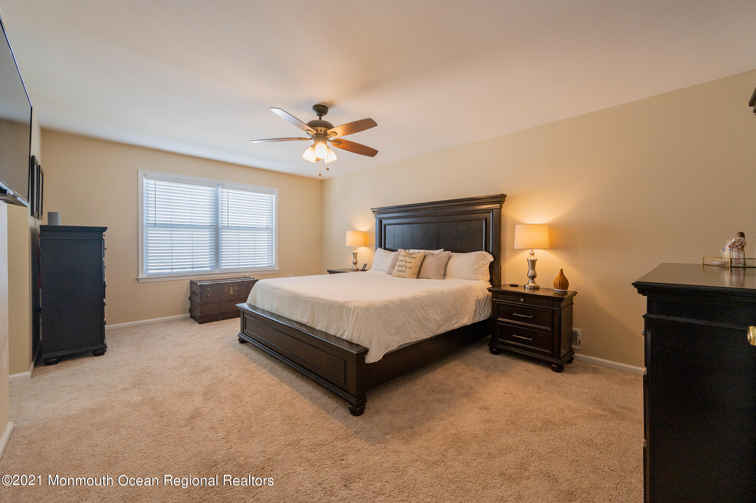 121 Lanyard Road Manahawkin, NJ 08050 - Photo 24 of 39 a bedroom with a bed dresser and a window