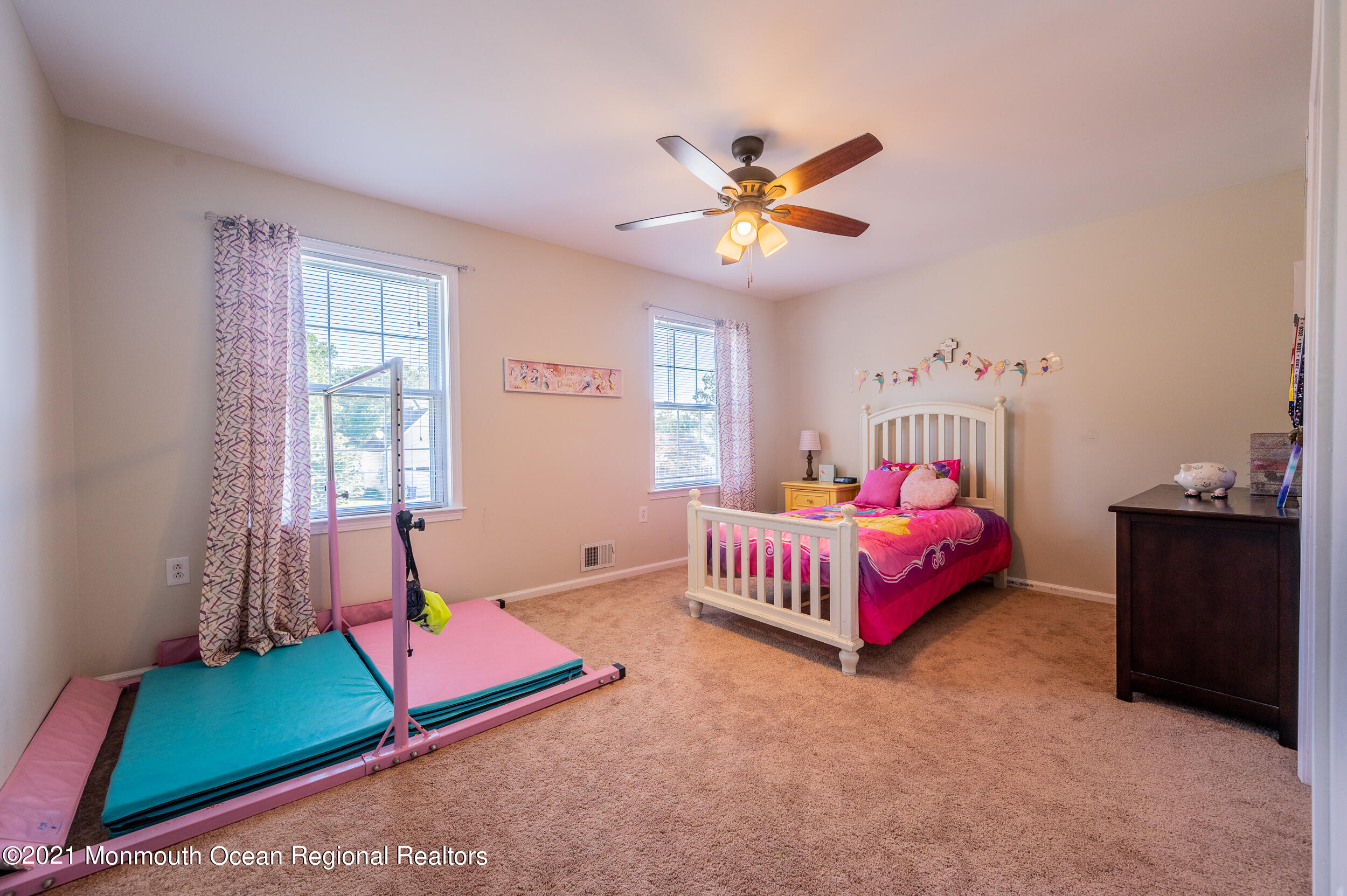 121 Lanyard Road Manahawkin, NJ 08050 - Photo 29 of 39 a bedroom with a bed and a window