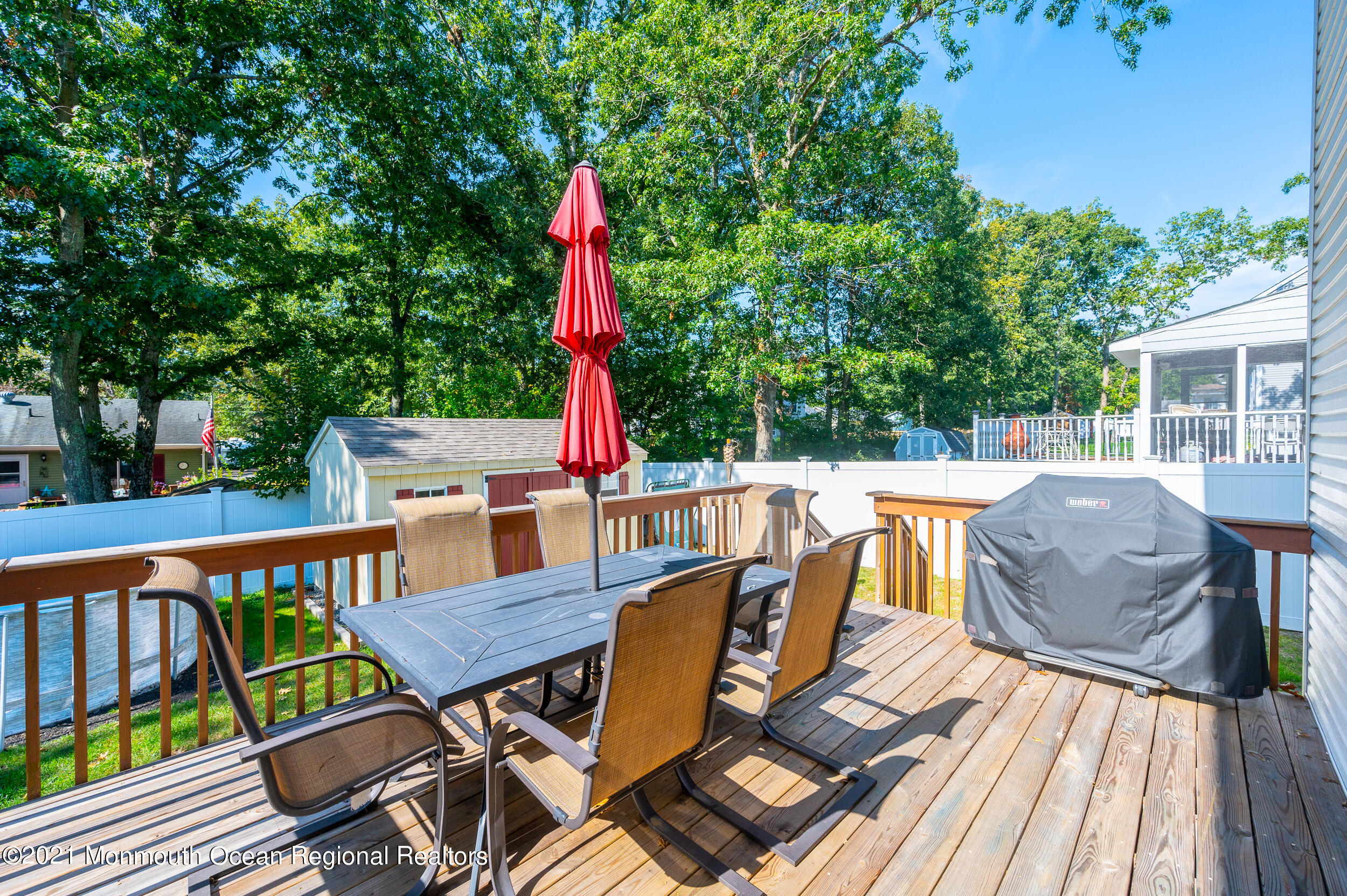 121 Lanyard Road Manahawkin, NJ 08050 - Photo 33 of 39 a view of deck with furniture and trees