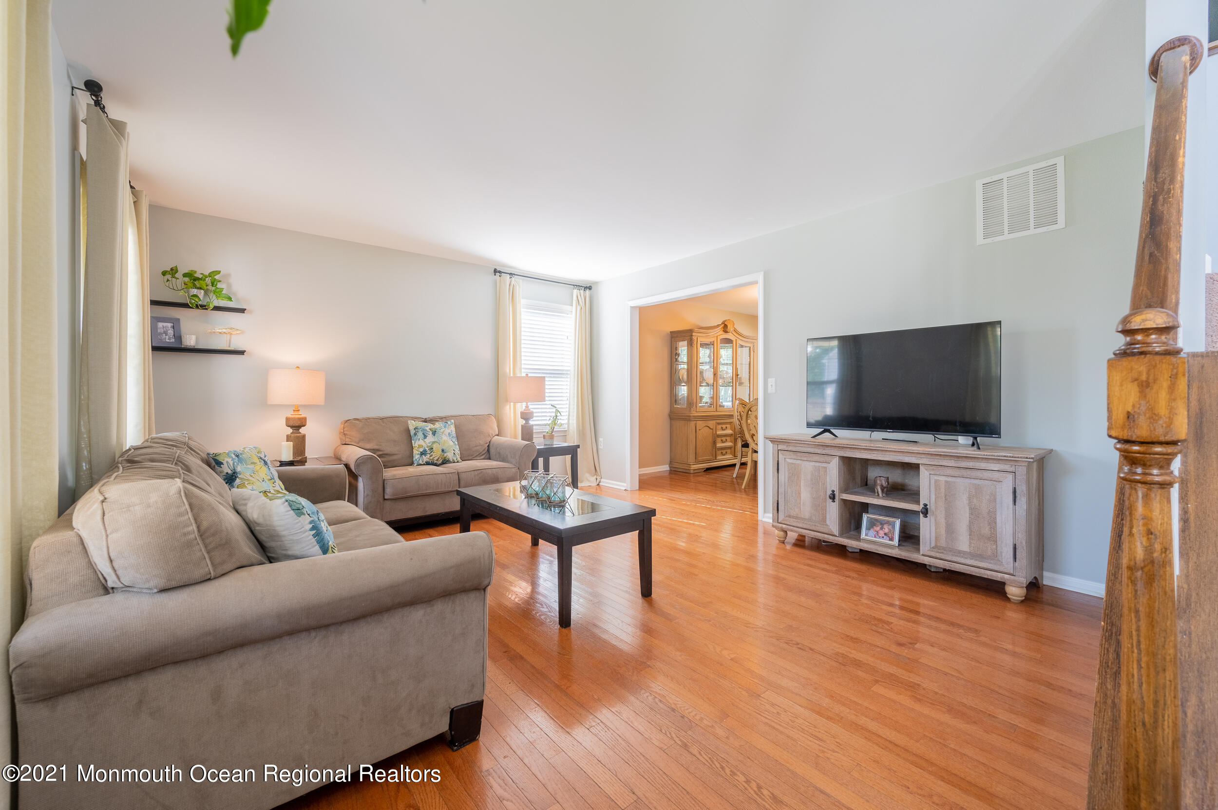 121 Lanyard Road Manahawkin, NJ 08050 - Photo 7 of 39 a living room with furniture and a flat screen tv