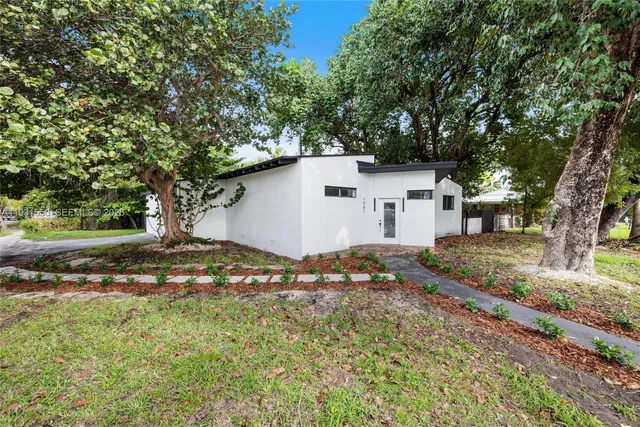 a backyard of a house with lots of green space