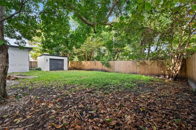 a house view with a backyard space
