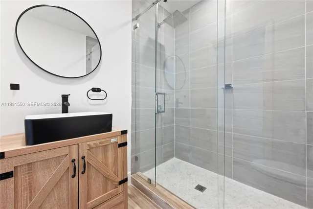 a bathroom with a sink and a mirror
