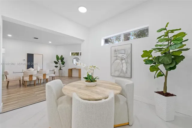 a living room with furniture flowerpot and flower pot