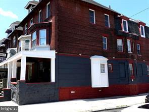 5013 Chester Avenue, Unit 1 Philadelphia, PA 19143 - Photo 2 of 12 a front view of a building with glass windows